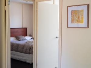 מיטה או מיטות בחדר ב-Park Avenue Holiday Units