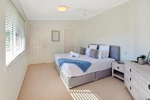 En eller flere senge i et værelse på Advance Place