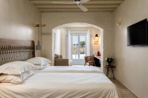 Posteľ alebo postele v izbe v ubytovaní Poseidon Hotel Suites