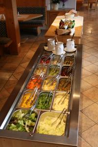 a buffet line with many different types of food at Alpenhof Strenge in Birnbaum