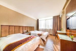Postelja oz. postelje v sobi nastanitve Kaiserdom Hotel Baiyun Airport-24-hour Airport-Free shuttle bus