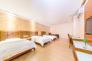 Postelja oz. postelje v sobi nastanitve Kaiserdom Hotel Baiyun Airport-24-hour Airport-Free shuttle bus