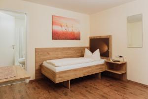 
Ein Bett oder Betten in einem Zimmer der Unterkunft Gästehaus Hötzl
