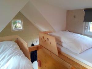 Postel nebo postele na pokoji v ubytování Tiny House + 9 fotografií