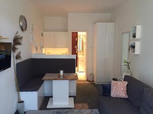 a living room with a couch and a table at RESET ul. Ratibora 66 in Jurata