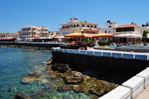 a body of water with buildings in the background at Emily's House in Kissamos