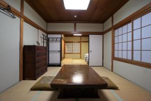a room with a table in the middle of it at Villa Kyoto Saiin in Kyoto