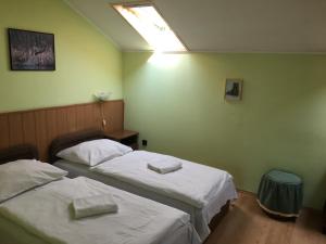 Postel nebo postele na pokoji v ubytování Muskátli Panzió