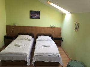 Postel nebo postele na pokoji v ubytování Muskátli Panzió