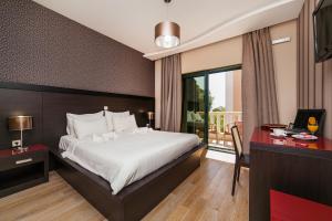 Postel nebo postele na pokoji v ubytování Apartments Grifone Lux