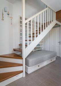 Postel nebo postele na pokoji v ubytování Blue Wave Aigli Villa + 11 fotografií