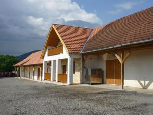 a row of buildings with brown roofs at Olze Panzió in Erdőbénye