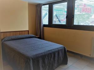 Llit o llits en una habitació de Hotel Refugi dels Isards