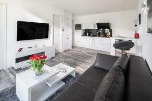 TV a/nebo společenská místnost v ubytování MeerZeit 8 - Norderney - Winterstraße 19