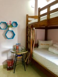 Postel nebo postele na pokoji v ubytování Ruby Hostel Hà Giang