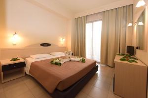 Postel nebo postele na pokoji v ubytování Santa Helena Hotel