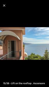 a picture of a house with a view of the water at Appartamento Villa Panorama in Mortola Inferiore