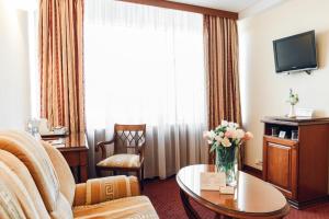 TV a/nebo společenská místnost v ubytování Premier Hotel Rus
