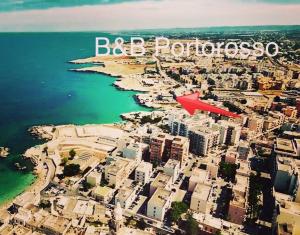an aerial view of a city with the words big portugal at B&B Portorosso in Monopoli