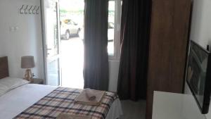 Postel nebo postele na pokoji v ubytování Apartments Stevo Nikočević