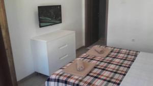 Postel nebo postele na pokoji v ubytování Apartments Stevo Nikočević