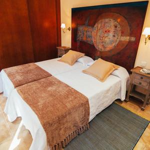 Postel nebo postele na pokoji v ubytování La Aldea Colorada Casa Rural
