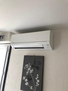 a kitchen with a white stove hood in a room at Central Hotel in Niort