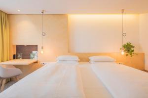 Postel nebo postele na pokoji v ubytování Hotel Luise