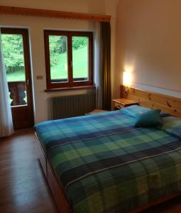 Postel nebo postele na pokoji v ubytování Albergo Krissin