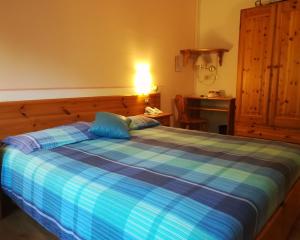 Postel nebo postele na pokoji v ubytování Albergo Krissin