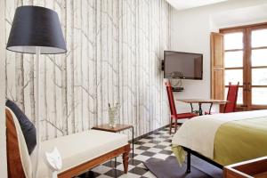 TV a/nebo společenská místnost v ubytování Del Carmen Concept Hotel Boutique by Chai