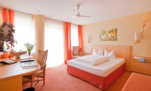 Postel nebo postele na pokoji v ubytování Hotel Luise