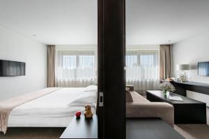 Postel nebo postele na pokoji v ubytování Amberton Hotel Klaipeda