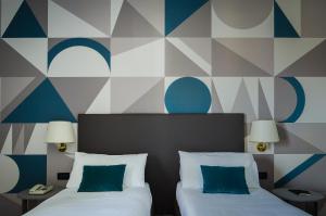Ένα ή περισσότερα κρεβάτια σε δωμάτιο στο Hotel Beatrice