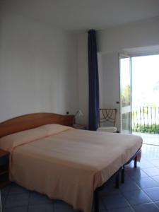 Postel nebo postele na pokoji v ubytování Hotel Casa Gerardo