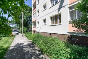 a sidewalk next to a building at Elite Apartments Center Grobla in Gdańsk