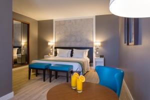 Кровать или кровати в номере AP Oriental Beach - Adults Friendly