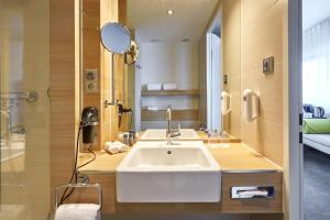 Koupelna v ubytování H+ Hotel Salzburg