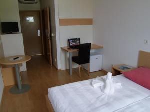 TV a/nebo společenská místnost v ubytování Hotel Galaksija Trebnje