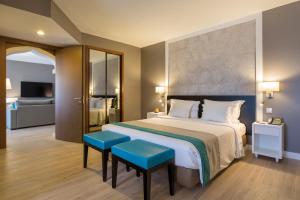 Кровать или кровати в номере AP Oriental Beach - Adults Friendly