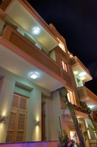 a building with lights on it at night at Residence Suites BY RAPHAEL HOTELS in Tel Aviv