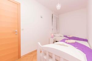 Ein Bett oder Betten in einem Zimmer der Unterkunft Apartment Ivanka