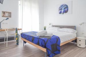Posteľ alebo postele v izbe v ubytovaní Nonna Pina Art Rooms