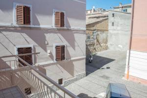 an overhead view of a building and a stairway at S186 - Sirolo, meraviglioso cielo-terra in centro storico in Sirolo