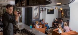 a man taking a picture of a group of people at Hôtel Restaurant Corto Maltese in Le Palais