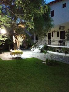 a picnic table in the yard of a house at Avra Ηouse in Kriopigi