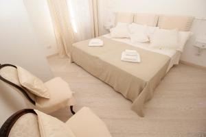 מיטה או מיטות בחדר ב-Blue Seagull by PortofinoHomes