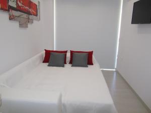 Een bed of bedden in een kamer bij Apartamento Fontanilla