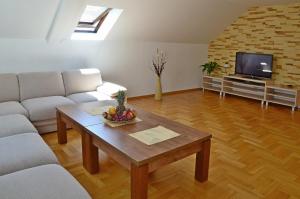 a living room with a couch and a coffee table at Willa u Basi in Miłków