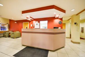 a lobby of a hospital with a reception counter at Americas Best Value Inn - East Syracuse in East Syracuse